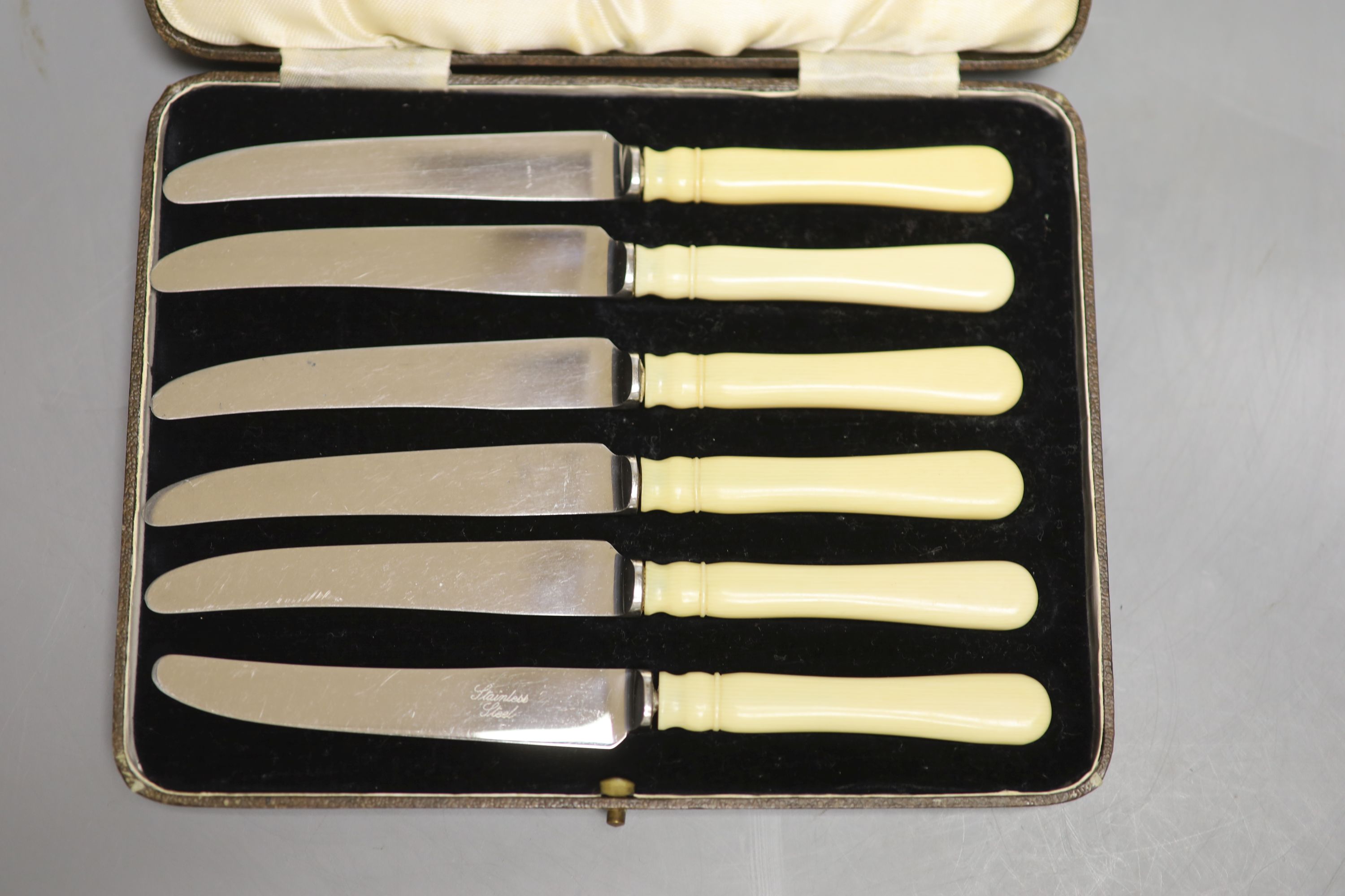 A silver-mounted amber cheroot holder, cased, with Russian inscription, Birmingham 1896 and sundry silver and plated flatware,